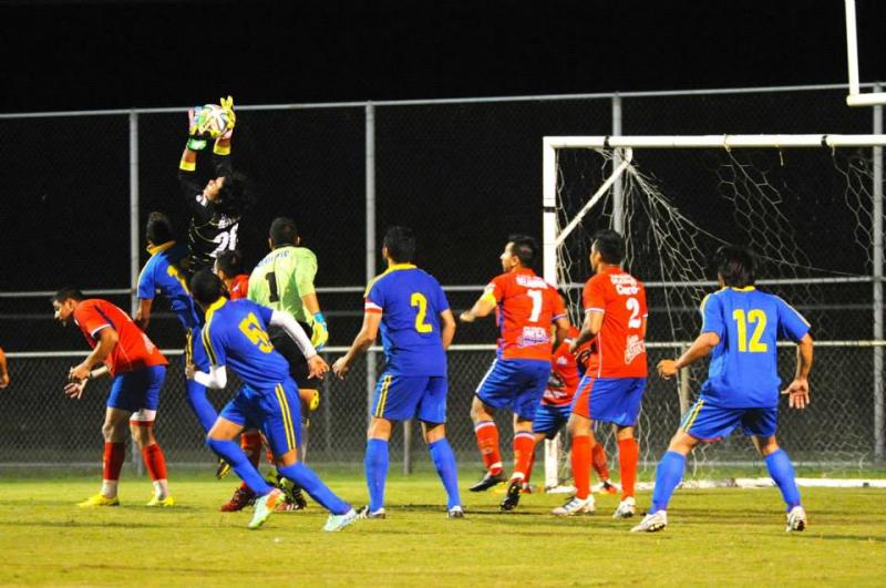 El Gato climbs the ladder and makes a save in the Hispanic League Championship game played at Sussex Tech in 2014. DAVE FREDERICK PHOTO